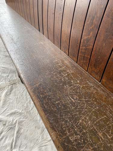 An antique oak waiting bench from Tower Bridge Magistrates Court