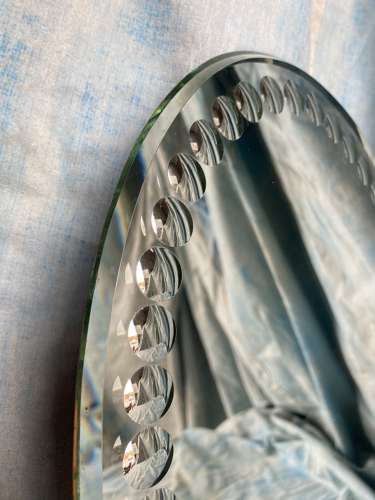 An oval antique sorcerer's / witches mirror