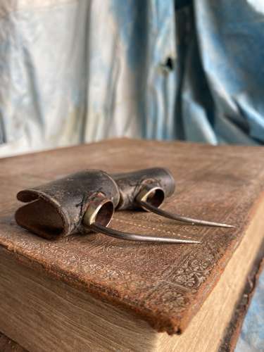 A pair of antique uncommon 19th century cock fighting spurs