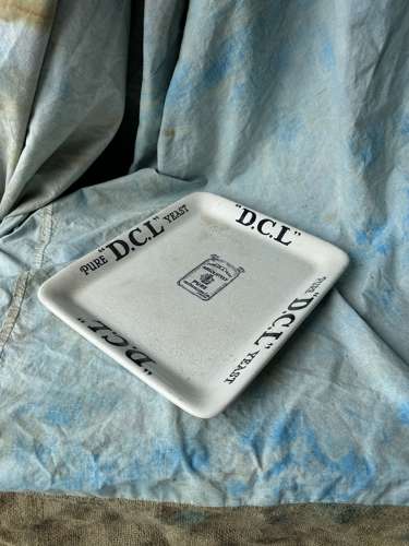 An antique Edwardian ironstone grocer's advertising plate - DCL yeast