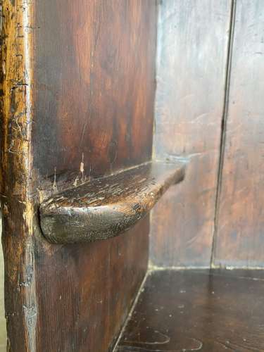 An antique George III pine barrel back tavern settle