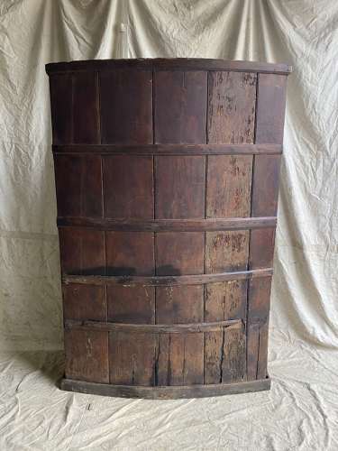 An antique George III pine barrel back tavern settle