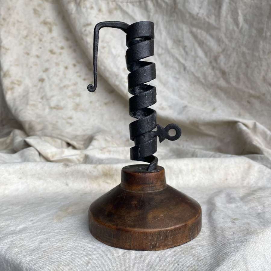 A French antique 19th century wrought iron cellar candlestick