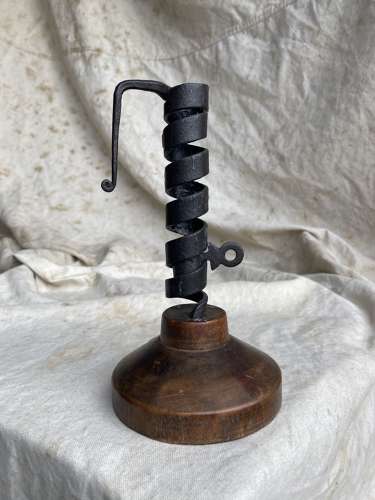 A French antique 19th century wrought iron cellar candlestick