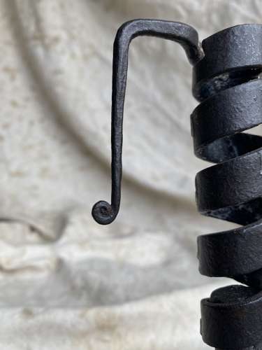 A French antique 19th century wrought iron cellar candlestick