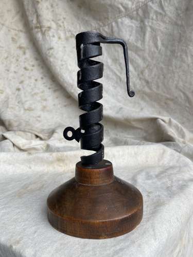 A French antique 19th century wrought iron cellar candlestick