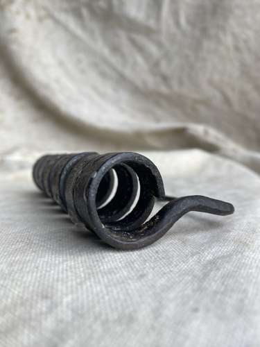 A French antique 19th century wrought iron cellar candlestick