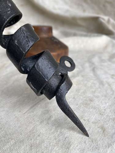 A French antique 19th century wrought iron cellar candlestick