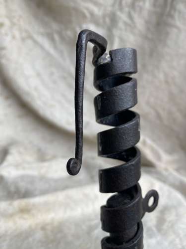 A French antique 19th century wrought iron cellar candlestick