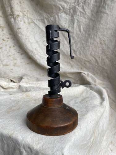 A French antique 19th century wrought iron cellar candlestick