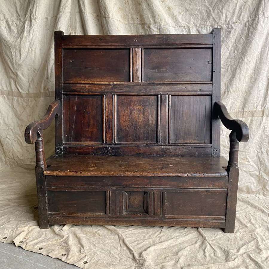 A charming antique 18th century Welsh panelled oak box settle