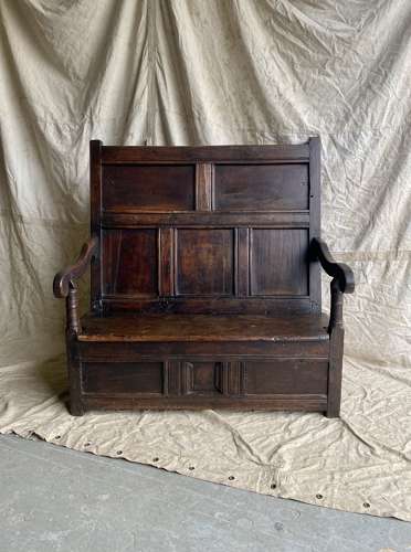 A charming antique 18th century Welsh panelled oak box settle