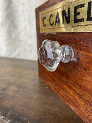 A bank of antique late Victorian apothecary shop drawers