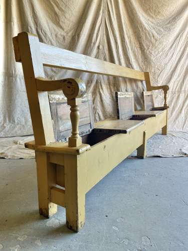 An antique 8ft Victorian pine school bench with seat storage