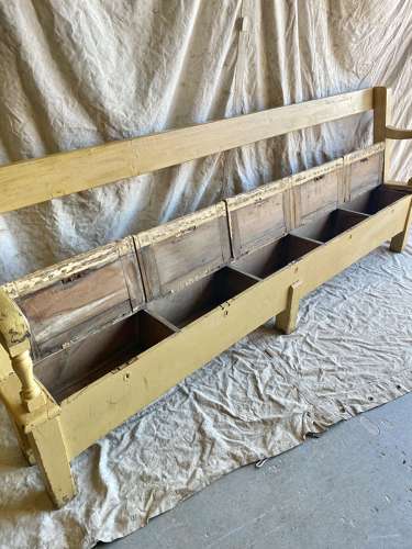 An antique 8ft Victorian pine school bench with seat storage