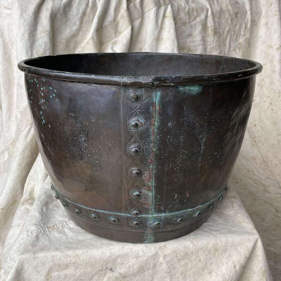 An antique 19th century riveted copper log bin