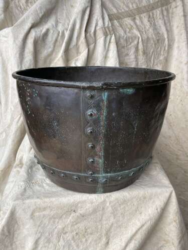 An antique 19th century riveted copper log bin