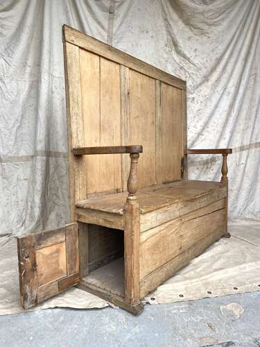 An antique early 19th century vernacular pine box settle