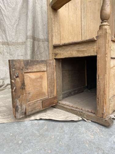 An antique early 19th century vernacular pine box settle