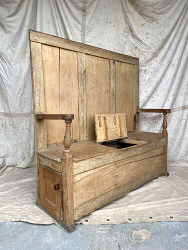 An antique early 19th century vernacular pine box settle