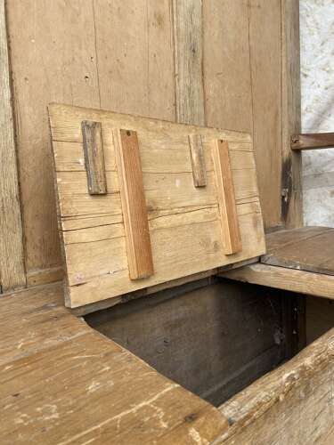 An antique early 19th century vernacular pine box settle