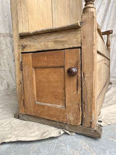 An antique early 19th century vernacular pine box settle