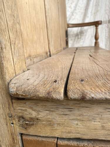 An antique early 19th century vernacular pine box settle