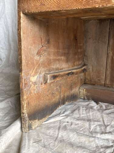 An antique George III pine barrel back tavern settle