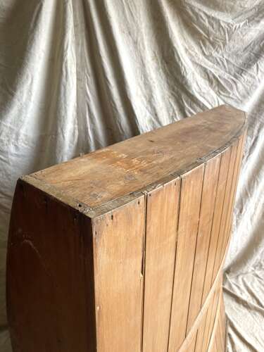 An antique George III pine barrel back tavern settle