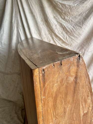 An antique George III pine barrel back tavern settle