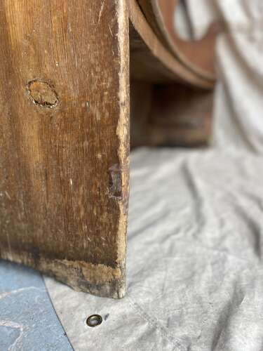 An antique George III pine barrel back tavern settle