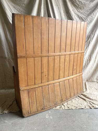 An antique George III pine barrel back tavern settle