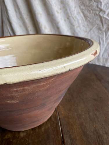 A large antique late 19th century Welsh glazed earthenware dairy bowl