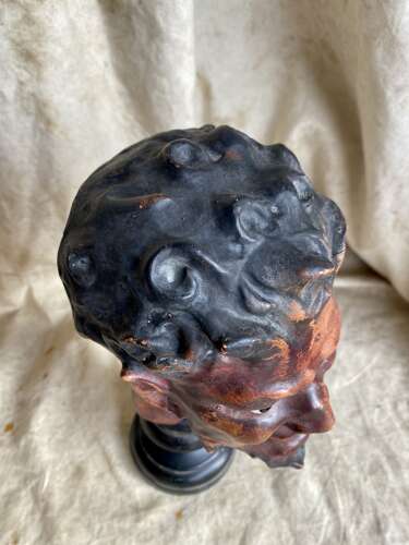 An antique late 19th century French plaster bust of a Faun or a Satyr