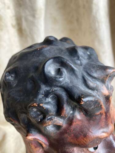 An antique late 19th century French plaster bust of a Faun or a Satyr