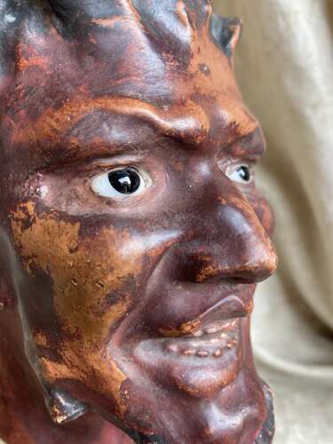 An antique late 19th century French plaster bust of a Faun or a Satyr