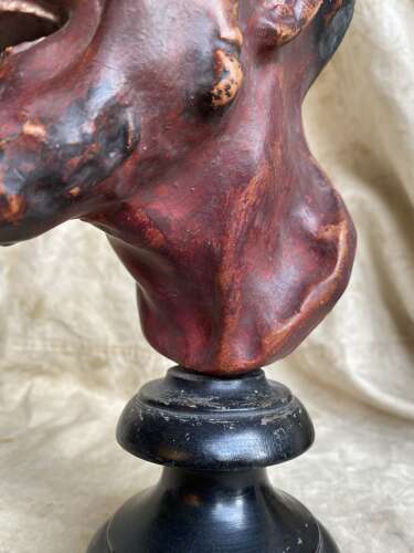 An antique late 19th century French plaster bust of a Faun or a Satyr