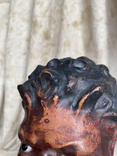 An antique late 19th century French plaster bust of a Faun or a Satyr