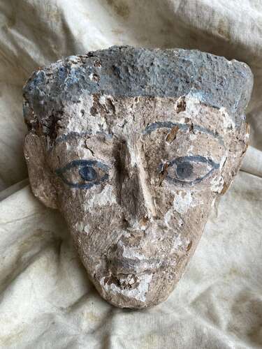 An ancient Egyptian gesso-painted wood sarcophagus mummy mask