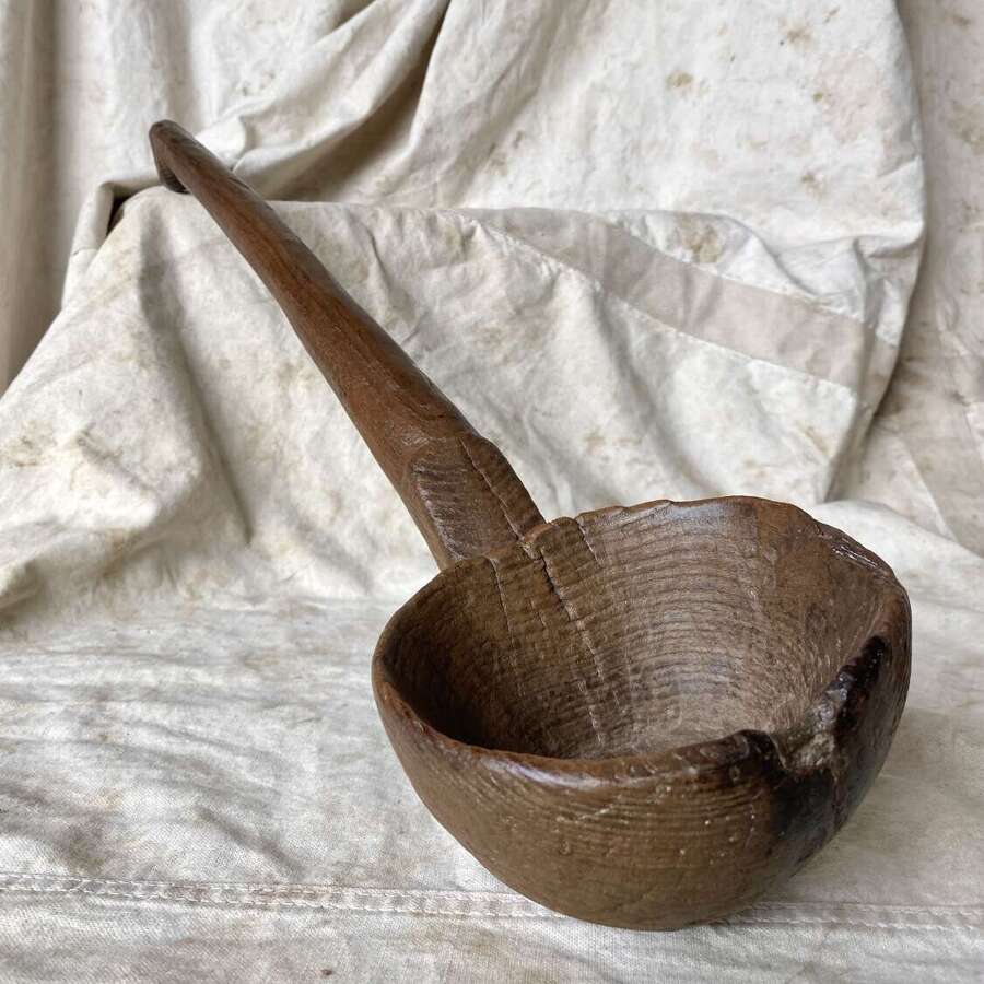 An exceptionally large antique Welsh treen fruit wood Cawl ladle