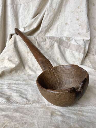 An exceptionally large antique Welsh treen fruit wood Cawl ladle
