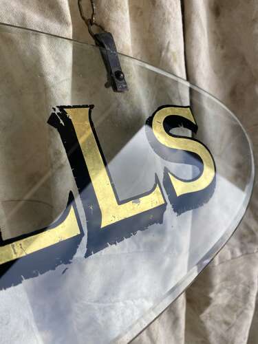 An antique early 20th century bevelled edge oval glass theatre sign