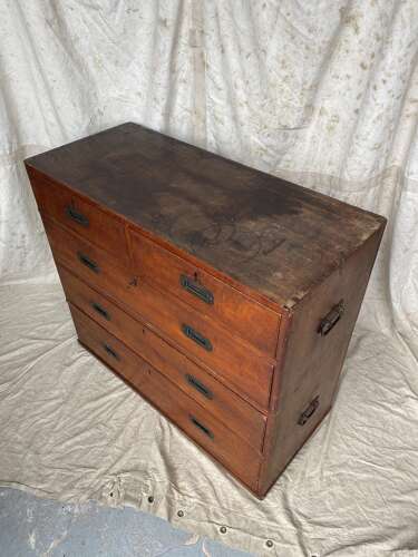 An antique 19th century three section teak campaign chest on chest with cupboard