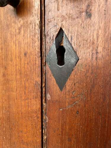 An antique 19th century three section teak campaign chest on chest with cupboard