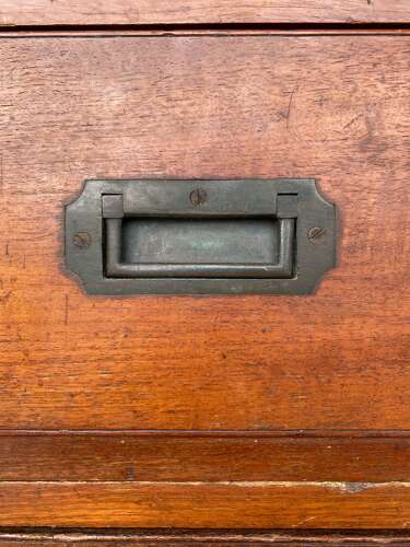An antique 19th century three section teak campaign chest on chest with cupboard