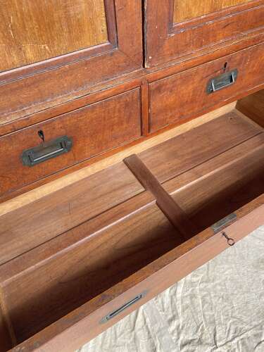 An antique 19th century three section teak campaign chest on chest with cupboard