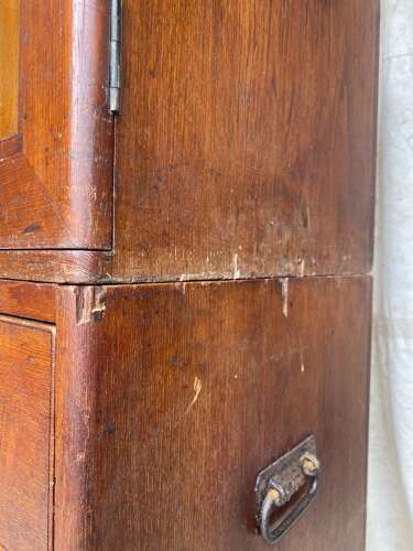 An antique 19th century three section teak campaign chest on chest with cupboard