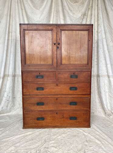 An antique 19th century three section teak campaign chest on chest with cupboard