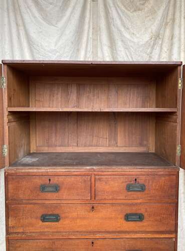 An antique 19th century three section teak campaign chest on chest with cupboard