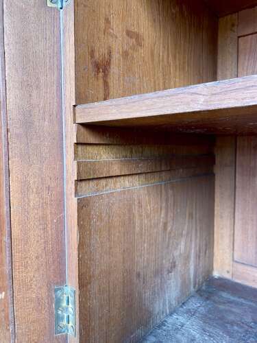An antique 19th century three section teak campaign chest on chest with cupboard